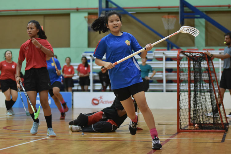 Pei Hwa's Tee Kai Lin (Pei Hwa #7) smiles after scoring her third goal of the day.