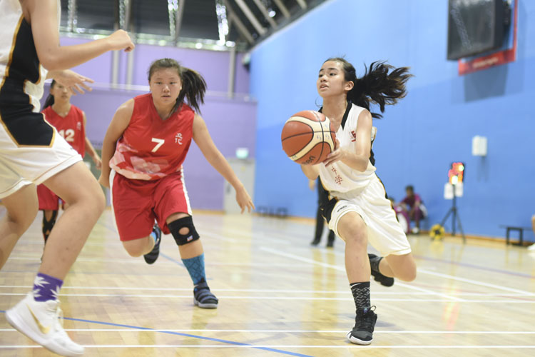 Celine (JSS #4) preparing for a shot at the hoop during the West zone B division basketball match between Jurong Secondary School and River Valley High School. (Photo 6 © Pang Chin Yee/REDintern)