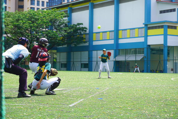 Wan Yu (#11) of Tanjong Katong Girls' School hitting a strong fly ball to left field during the game of Crescent Girls' School against Tanjong Katong Girls' School. (Photo 6 by © Pang Chin Yee /REDIntern)