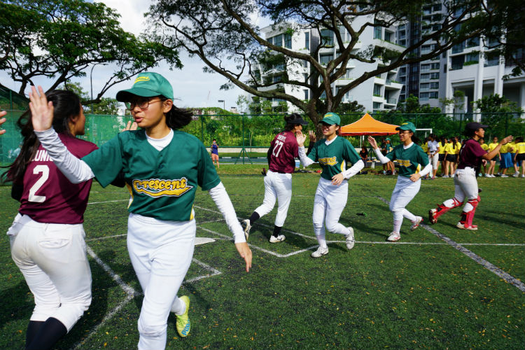 Crescent Girls' School and Tanjong Katong Girls' School players shaking hands and thanking each other for the match.(Photo 8 by © Pang Chin Yee /REDIntern)