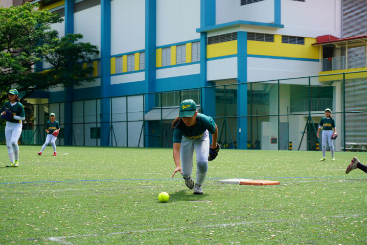 Regine (#01) of Crescent Girls' School recovering and picking up the ball after a wild throw to her during the game of Crescent Girls School  against Tanjong Katong Girls' School. (Photo 3 by © Pang Chin Yee /REDIntern)