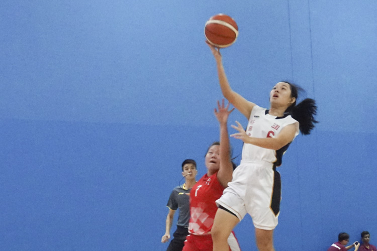 Valerie Tan (JSS #6) going for a lay up during the West zone B division basketball match between Jurong Secondary School and River Valley High School. (Photo 1 © Pang Chin Yee/REDintern)