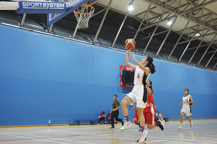 Valerie Tan (JSS #6) going for a lay up during the West zone B division basketball match between Jurong Secondary School and River Valley High School. (Photo 1 © Pang Chin Yee/REDintern)