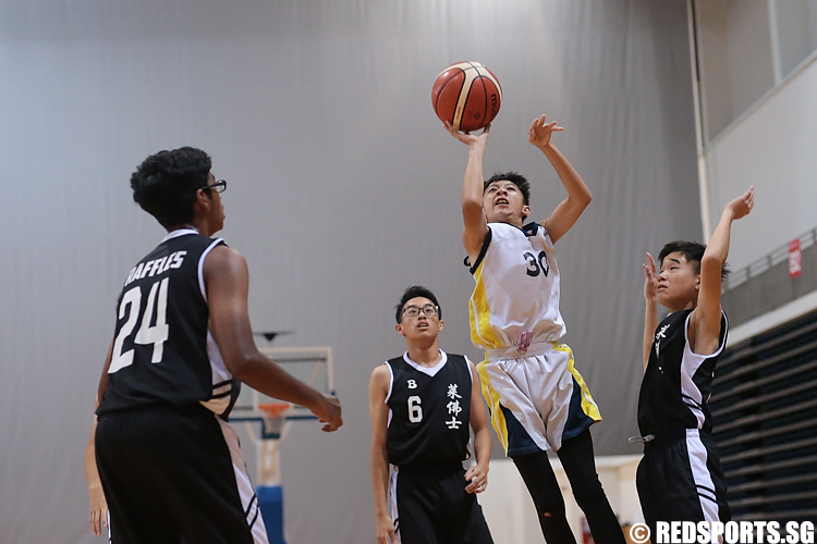 Evan Ang (#30) of Guangyang Secondary shoots against Raffles Institution. (Photo 6 © Lee Jian Wei/Red Sports)