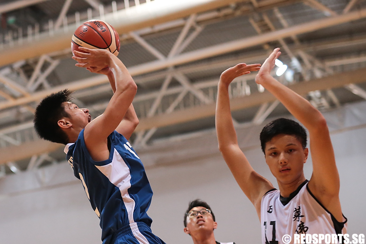 Tan Chao Khon (#12) of Pei Cai Secondary shoots against (#11) of Raffles Institution. (Photo 5 © Lee Jian Wei/Red Sports)