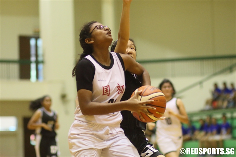 Aruna D/O Vadivelu (NJC #21) takes aim for an under basket attempt. (Photo 4 © Dylan Chua/Red Sports)