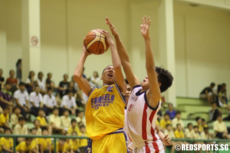 Russell Lim (FMS #12) rises for a contested lay-up. He scored a game-high 21 points despite the loss. (Photo 1 © Dylan Chua/Red Sports)