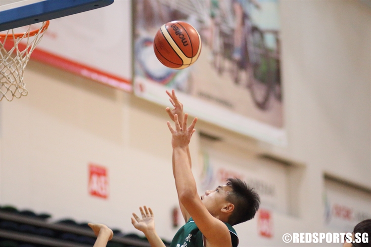 Gian Rafael Bernardo Palermo (CHR #22) shoots from beneath the basket. (Photo 4 © Dylan Chua/Red Sports)