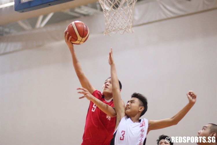 Liam Seth Israel (Dunman #9) rises for a lay-up. He bagged a team-high 16 points in the victory. (Photo 1 © Dylan Chua/Red Sports)
