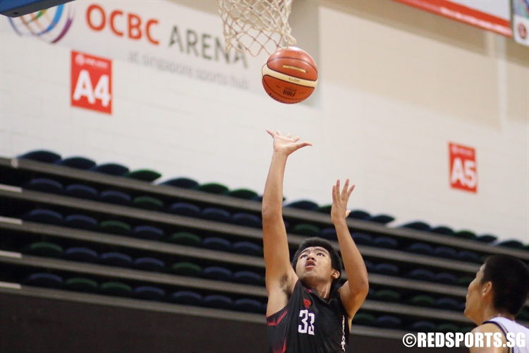 Maran Markus (NAS #33) rises for a shot in the paint. He bagged a game-high 23 points against Fairfield Methodist. (Photo 1 © Dylan Chua/Red Sports)