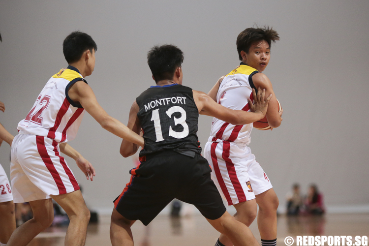 Daniel Baking (#4) of ACS (Barker) looks to pass the ball to his teammate. (Photo © Lee Jian Wei/Red Sports)