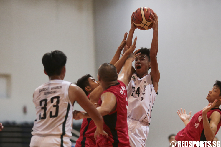 Pang Ming Hui (#34) of Christ Church Secondary steals the rebound against Dunman Secondary. (Photo © Lee Jian Wei/Red Sports)