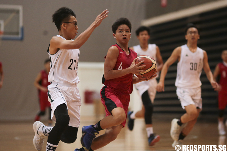 Joseph Marquez (#4) of Dunman Secondary drives against Christ Church Secondary. (Photo © Lee Jian Wei/Red Sports)