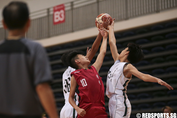 Bryan Yong (#10) of Dunman Secondary fights for the rebound against Brendon Hao (#35) and Terrell Yu (#25) of Christ Church Secondary. (Photo © Lee Jian Wei/Red Sports)