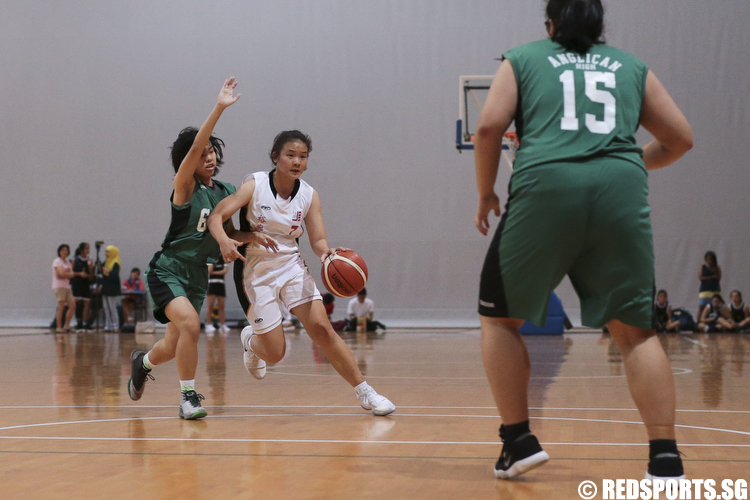 Valerie Lim (#7) of Jurong Secondary drives against Soo Wei Kei (#6) of Anglican High. (Photo © Lee Jian Wei/Red Sports)