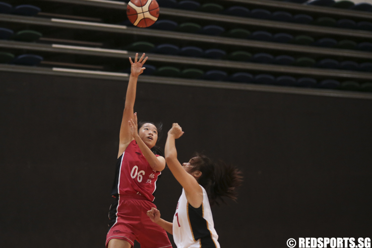 Regine Ng (#6) of St. Margaret's Secondary shoots against Valerie (#7) of Jurong Secondary. (Photo © Lee Jian Wei/Red Sports)