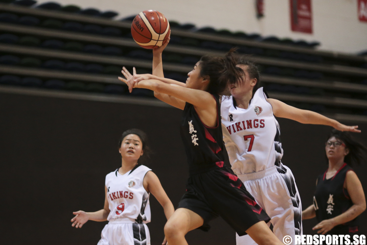 (#8) of Ngee Ann Secondary goes for the layup but was denied by Lydia Ang (#7) of North Vista Secondary. (Photo © Lee Jian Wei/Red Sports)