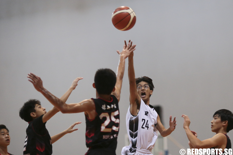Lain Sang (#24) of Ngee Ann Secondary shoots against Damien Yau (#25) of North Vista Secondary. (Photo © Lee Jian Wei/Red Sports)