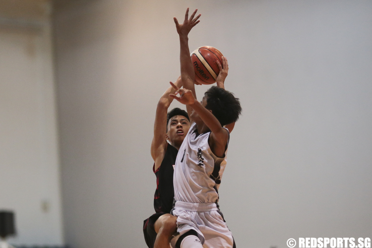 Brenndon Sim (#5) of North Vista Secondary shoots against Adam Tan (#1) of Ngee Ann Secondary. (Photo © Lee Jian Wei/Red Sports)