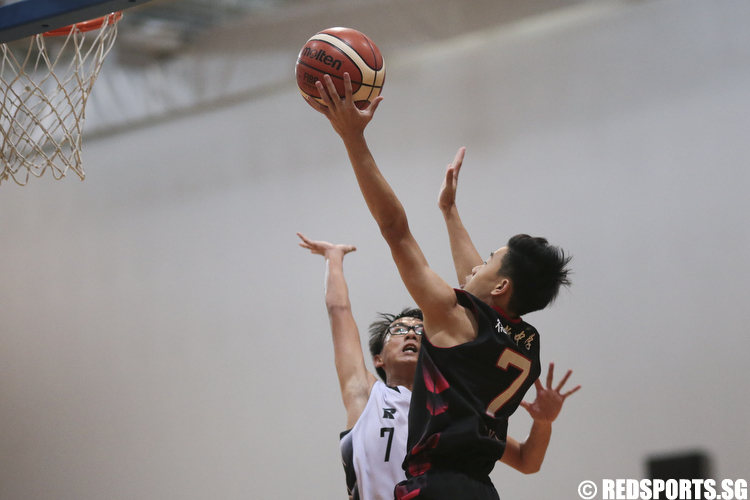 Amos Tai (#7) of North Vista Secondary shoots a layup against Ambrose Quek (#7) of Ngee Ann Secondary. (Photo © Lee Jian Wei/Red Sports)