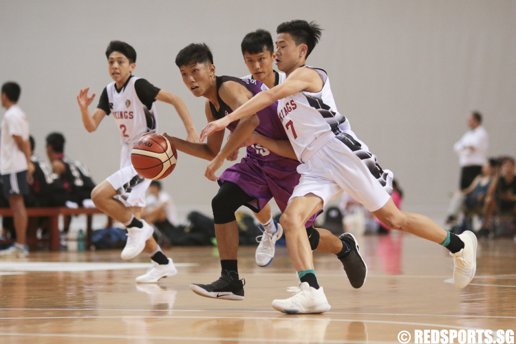 Edric (#15) of Jurong West Secondary drives against  Amos Tai (#7) of North Vista Secondary. (Photo © Lee Jian Wei/Red Sports)