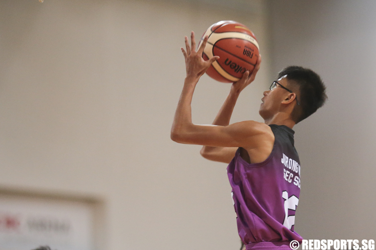 Robin (#12) of Jurong West Secondary shoots against North Vista Secondary. (Photo © Lee Jian Wei/Red Sports)
