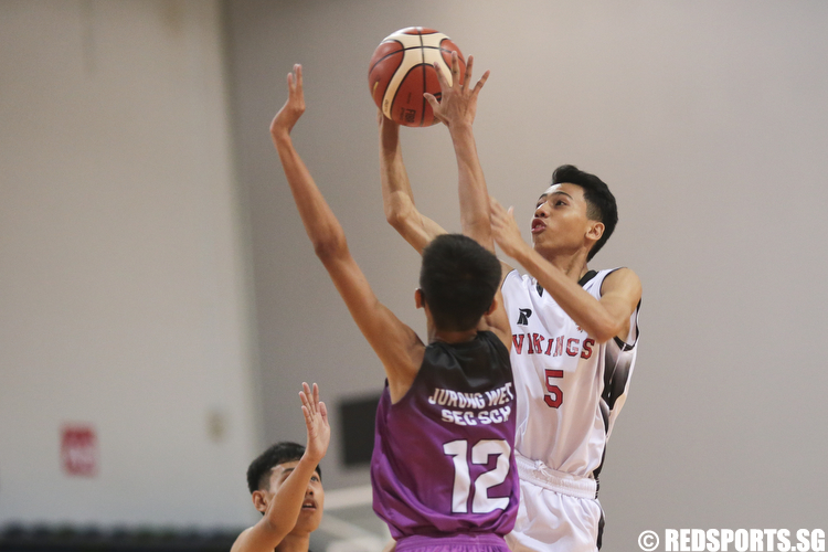 Brenndon Ariffin (#5) of North Vista Secondary shoots against Robin (#12) of Jurong West Secondary. (Photo © Lee Jian Wei/Red Sports)