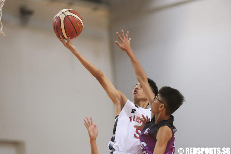 Brenndon Ariffin (#5) of North Vista Secondary shoots a layup against Robin (#12) of Jurong West Secondary. (Photo © Lee Jian Wei/Red Sports)