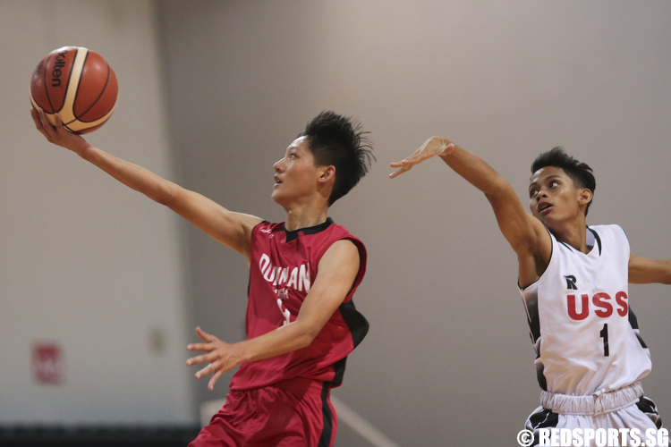 Lucas (#9) of Dunman Secondary shoots a layup against Melvin Chua (#1) of Unity Secondary. (Photo © Lee Jian Wei/Red Sports)