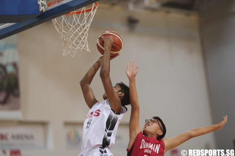 Nurhairie Nazief (#15) of Unity Secondary shoots against (#6) of Dunman High. (Photo © Lee Jian Wei/Red Sports)