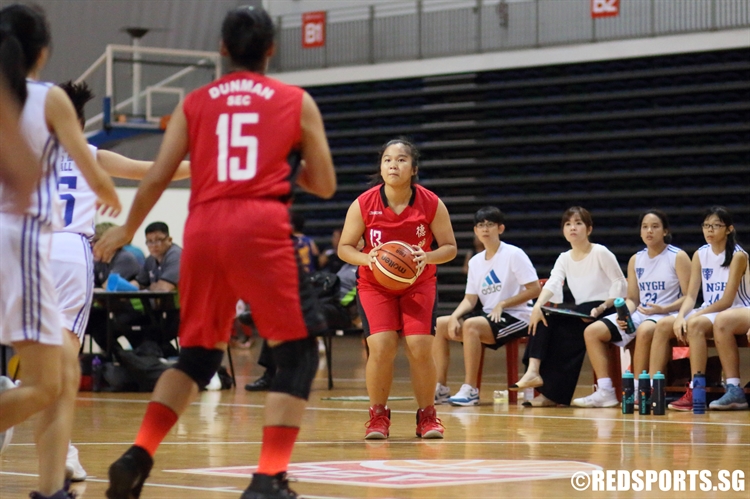 Tang Theresa Santos (Dunman #13) locks on the target from beyond the arc. (Photo 14 © Dylan Chua/Red Sports)