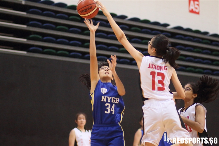 Loh Yu Xian (Jurong #13) rejects Emi Chow (NYGH #34) on a lay-up attempt. (Photo 3 © Dylan Chua/Red Sports)