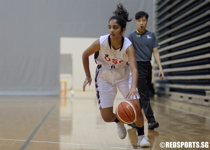 Alayna Robinson (US #11) on a drive to the hoop. She scored six points against SCGS. (Photo 2 © Dylan Chua/Red Sports)