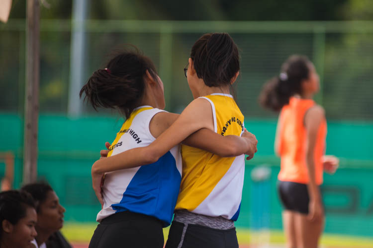 Hu Tianqi (#434) of Nanyang Girls' High School rejoices with her teammate Charmaine Chua Yu En (#425) after the former cleared a height of 1.50m. (Photo  © Lee Yu En/Red Sports)