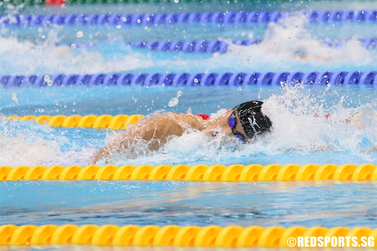 Jonathan Tan of Anglo-Chinese School (Independent) sprints to the finish in the A Division Boys’ 100m Freestyle final. (Photo  © Chan Hua Zheng/Red Sports)