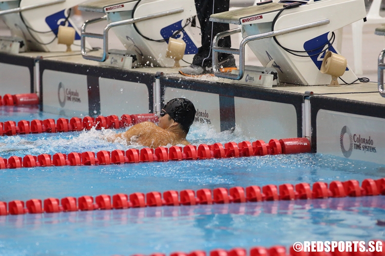 Jonathan Tan of Anglo-Chinese School (Independent) touches home to finish with a meet record of 51.80 seconds in the A Division Boys’ 100m Freestyle final. (Photo  © Chan Hua Zheng/Red Sports)