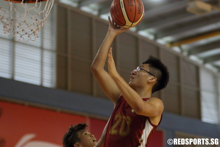 Fredy (SRJC #20) rises high for a shot under the basket. (Photo 8 © Dylan Chua/Red Sports)