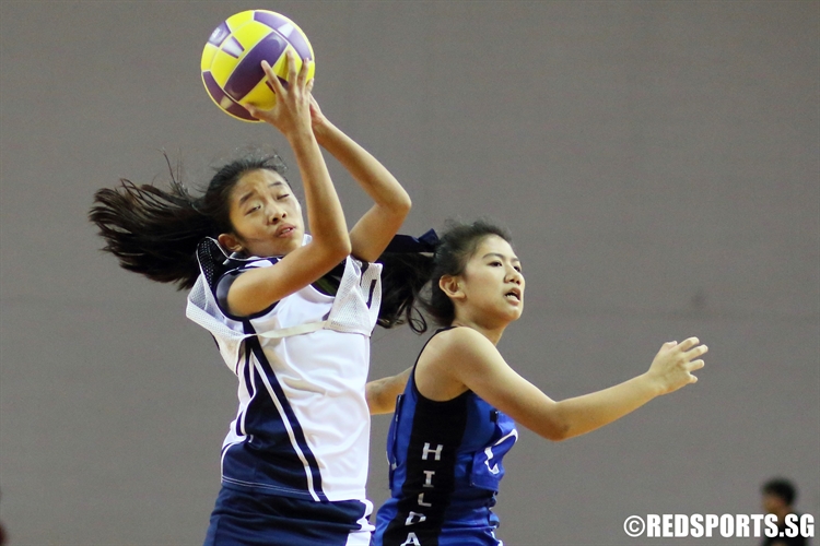 Seraphina Low (HIJ C) grabs the ball over her opponent in the final.(Photo 2 © Dylan Chua/Red Sports)