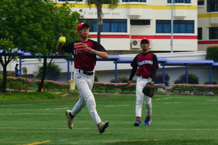 HCI's third baseman Silas (HCI #02) taking the last out of the match. (Photo 13 © REDintern Pang Chin Yee) 