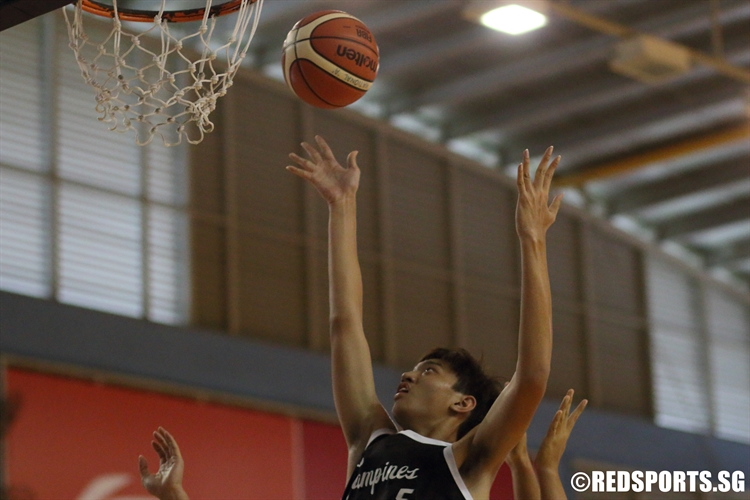 Sie Ker Shin (TPJC #5) rises for a put back off an offensive rebound. (Photo 9 © Dylan Chua/Red Sports)