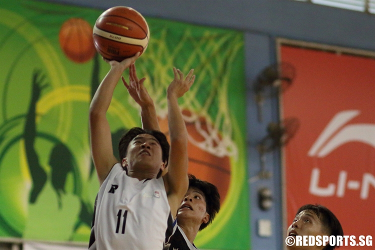 Tan Jun Nan (IYJC #11) shoots a contested shot in the paint. (Photo 4 © Dylan Chua/Red Sports)