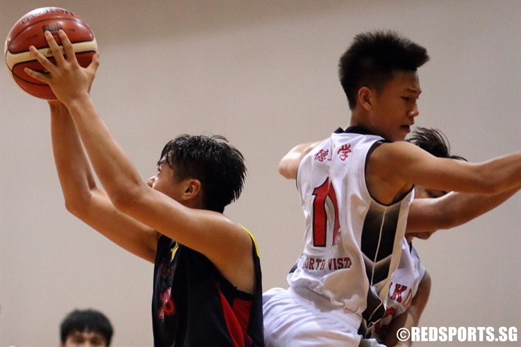 Xavier Tan (ACSB #28) fakes out two North Vista players in the paint. The big man scored 14 points in the game. (Photo 12 © Dylan Chua/Red Sports)