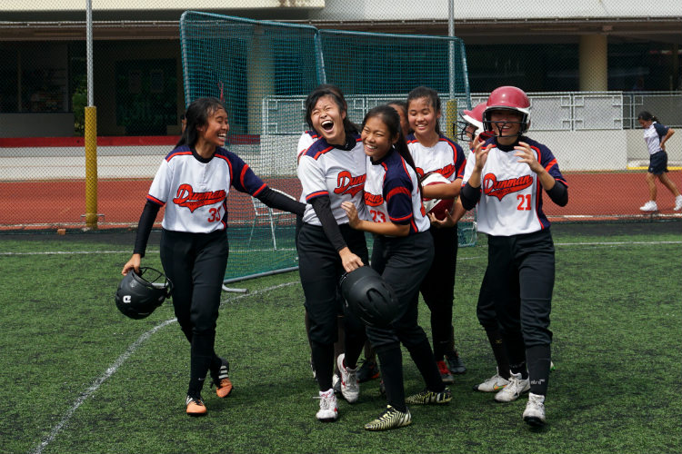 Xinyi (DHS #20) returning home into the arms of her teammates after hitting Dunman's sole homerun. (Photo 6 © REDintern Pang Chin Yee)