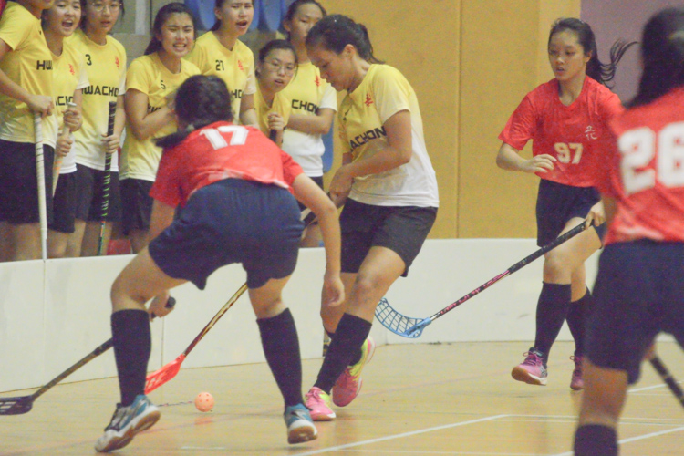 Briana Toh (HCI #12) dribbles past the opposing player. (Photo 3 © REDintern Nathiyaah Sakthimogan)