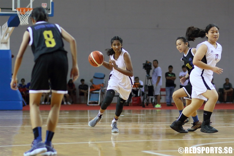 Crystal Nathasha (SCGS #9) drives through the defense to the hoop. She finished with a team-high 15 points in the victory. (Photo © Chan Hua Zheng/Red Sports)