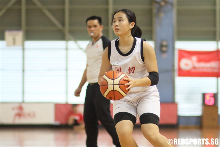 Chloe Tan (NJC #30) grabs the ball along the perimeter. Chloe scored a team-high seven points against RI. (Photo 2 © Dylan Chua/Red Sports)