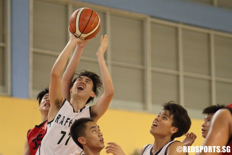 Bryan Teo (RI #77) soars for a tough lay-up on his way to a seven-point performance. (Photo 13 © Dylan Chua/Red Sports)