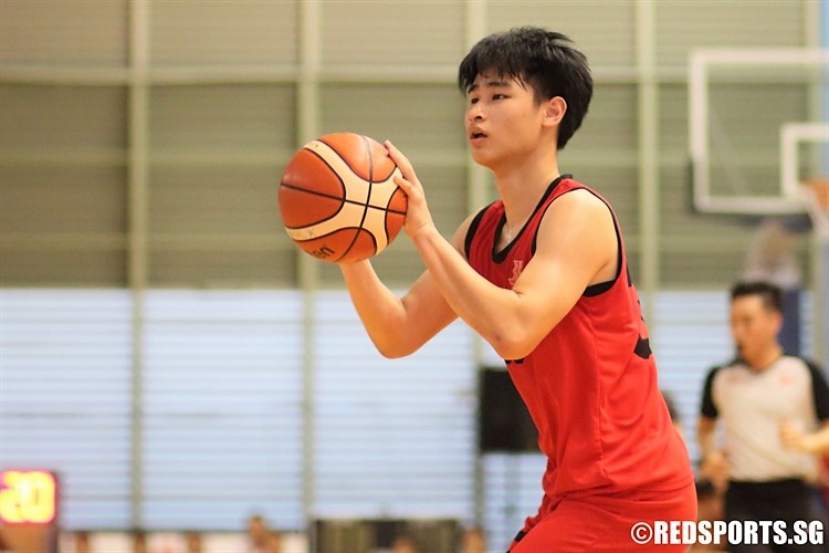 Vernen Lim (HCI #35) squares up for a three-pointer. (Photo 3 © Dylan Chua/Red Sports)