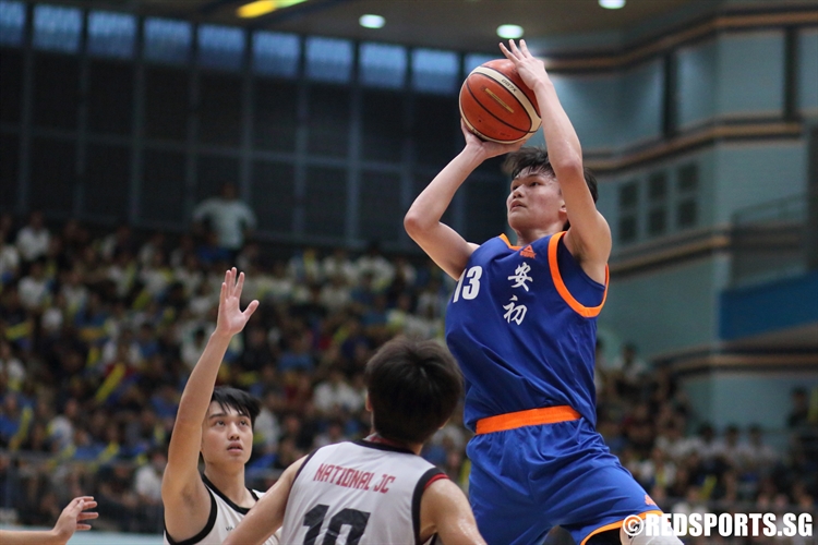 Xavier Ng (AJC #13) elevates over the defense for a jump-shot. He poured in a team-high 21 points in the victory. (Photo © Chan Hua Zheng/Red Sports)