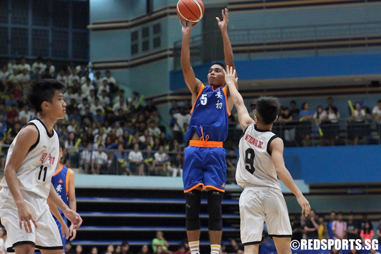 Ram Sunda Putra (AJC #25) pulls up for three over the defense. He tallied 16 points and bagged the MVP award in the victory. (Photo  © Chan Hua Zheng/Red Sports)
